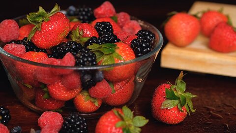 #Glass bowl full of red berries seen in detail#