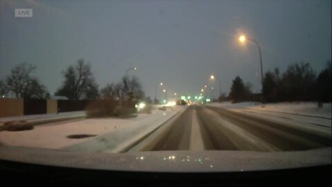 Roads are slippery, snow-covered as snow storm moves across the Front Range