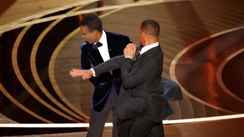 Watch the uncensored moment Will Smith smacks Chris Rock on stage at the Oscars, drops F-bomb