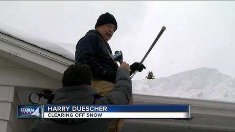 Green Bay neighbors clean up after record breaking snowfall