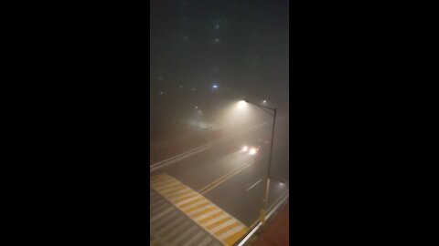 A car running through severe fog