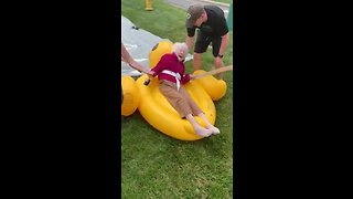 Elderly woman enjoys tube slide for Senior Heath and Wellness Day