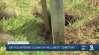 GE volunteers clean up cemetery