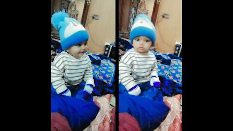 World Cutest baby boy smiling instantly become serious for cam picture .