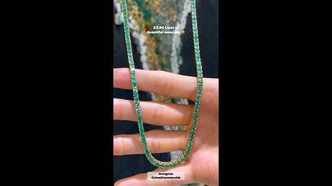 Hand making a round emerald 18 inch tennis 14K gold tennis necklace - making jewelry