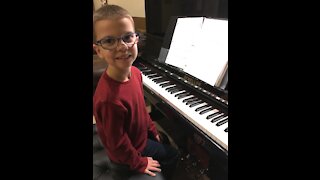 Musically gifted child plays God Rest Ye Merry Gentlemen