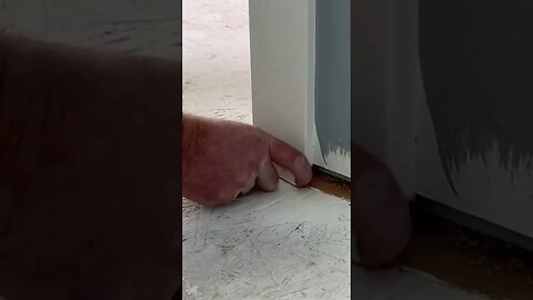 Using Oscillating Multi-Tool to trim door casing for tile installation.#tools #tile #trim