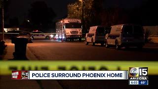 Police surround Phoenix home overnight