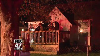 Firefighters battle house fire in Lansing