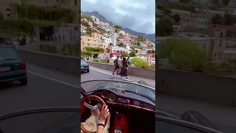 Journey in a vintage '63 Alfa Romeo convertible through the narrow streets of Amalfi.