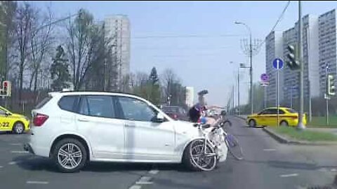 Cyclist flung in air by car during violent collision