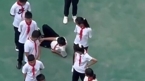 Chinese Boy Passes Out Hard While Class Was Forced To Stand Outside In 95 Degree Heat For Punishment