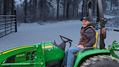 John Deere 3033R Plowing Snow.