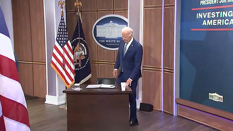 Here's President Biden At His Tiny Fake White House Desk