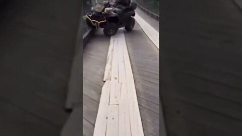 And he’s gone😳#shorts #crazyvideo #bridge #ragingriver #crash #atv #sweptaway