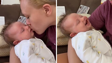 Sleeping Newborn Smiles When Kissed