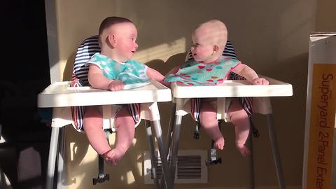 Twins engage in hilarious giggle fit