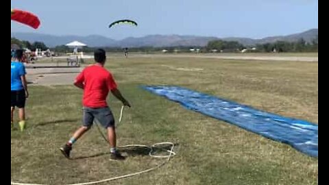 Skydiver ends jump on a Slip 'N Slide