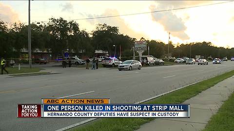 One person killed in shooting at a strip mall