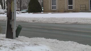 Few cars on the road as snow falls in Harford County