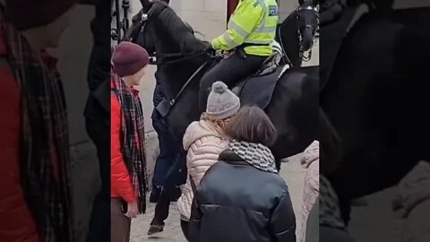 Police woman on horse back almost walking over tourist #horseguardsparade