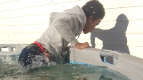 A Young Boy Falls Into a Frozen Pool