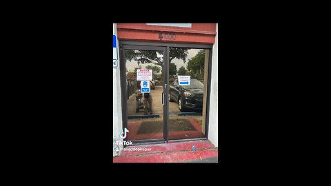 Commercial storefront door repair; door hinges/pivots replacement, in Pompano Beach, Florida.