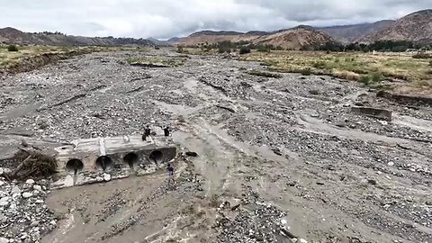 DRONE SURVEY OF THE WIPED OUT BRIDGE NORTH OF BANNING, CALIFORNIA AND THE MASSIVE TRAFFIC JAM ON...