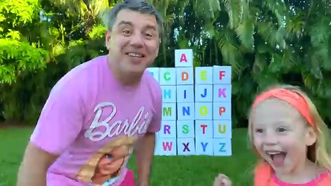 Nastya and dad open boxes with surprises to learn the alphabet.