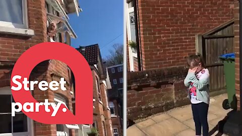 Entire street sing Happy Birthday to little girl