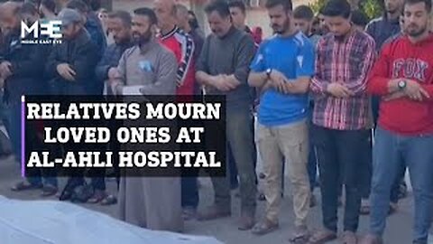 Relatives mourn their loved ones at al-Ahli hospital in Gaza