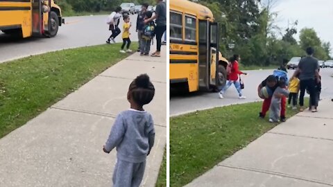 Little Sister Adorably Welcomes Big Brother Home From School