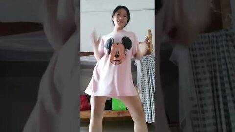 Young Chinese Girl Dances With Mickey Mouse