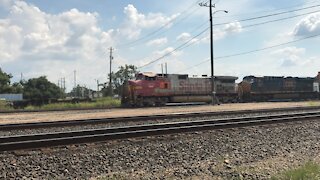 BNSF Stacktrain led by Santa Fe war bonnet and CSX locomotive Rosenberg Texas 8/15/21