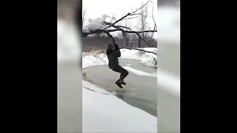 this man fall while hanging to a tree branch