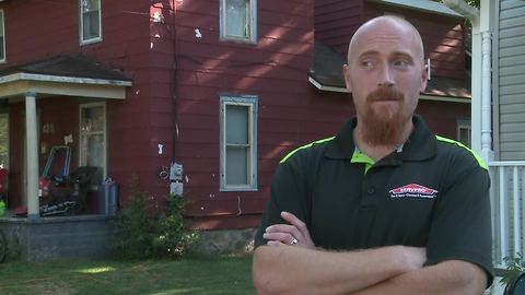 Volunteers clean up trash piled up outside Charlotte home