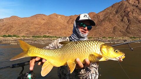 Catching yellowfish and barble in the Orange river! Camping remotely! River rafting down the river.