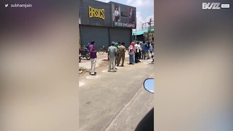 Huge queue in India respects social distancing regulations