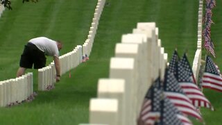 Honoring the fallen: Group takes Memorial Day road trip to place 1,600 flags on gravesites