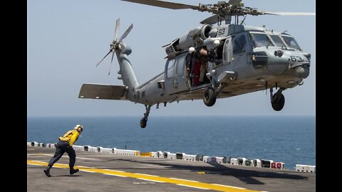 Aviation Boatswain’s Mate Directs a MH-60S Sea Hawk Aboard Amphibious Assault Ship USS Essex