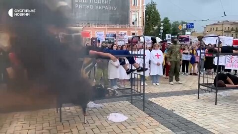 A scene staged in Kyiv of Azov members burning in the Yelenovka POW camp during the recent attack