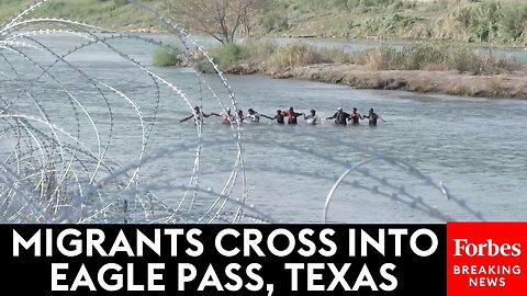 Scenes From The Rio Grande- Migrants Form Chain As They Enter Eagle Eagle Pass, Texas, From Mexico