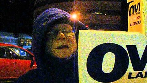 A sign holder for Ovide Lamontagne at the Romney Manchester event 11 5 12