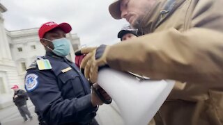 Video: Capitol Officer Seems To Work With Rioters To Aid More Officers