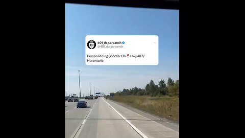 Man driving scooter on highway