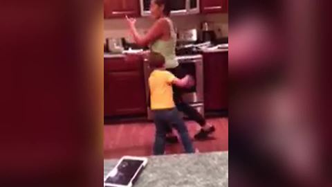 A Woman Knocks Her Son Down With Her Butt