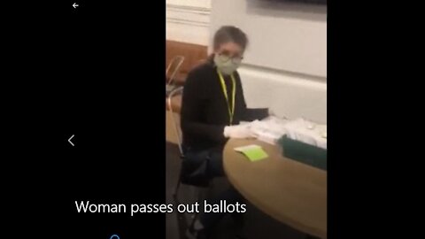 Woman Filling Out Ballots At Polling Station Possibly Identified