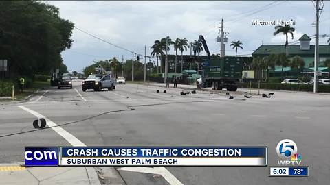 Crash knocks down power lines in West Palm Beach