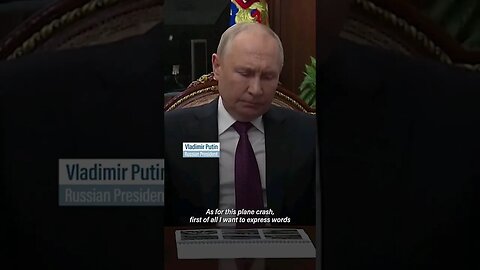 Putin pays respect to dead in plane crash