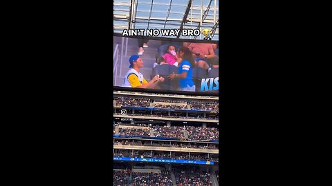 Man proposing to his girlfriend at an NFL game, only to be rejected and have food spilled on him